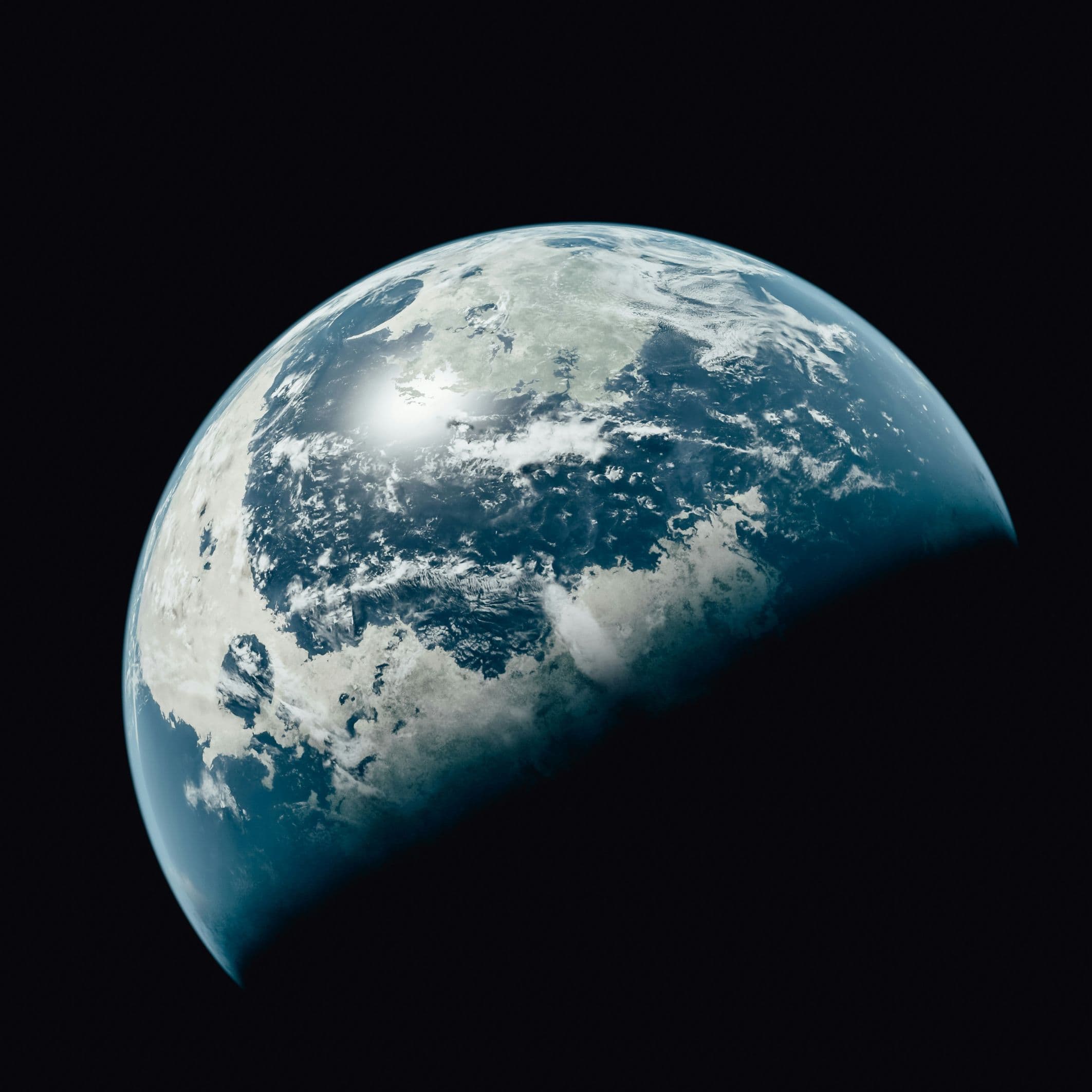 Earth from space showing oceans and clouds with bright light reflection, representing global climate and critical systems monitoring