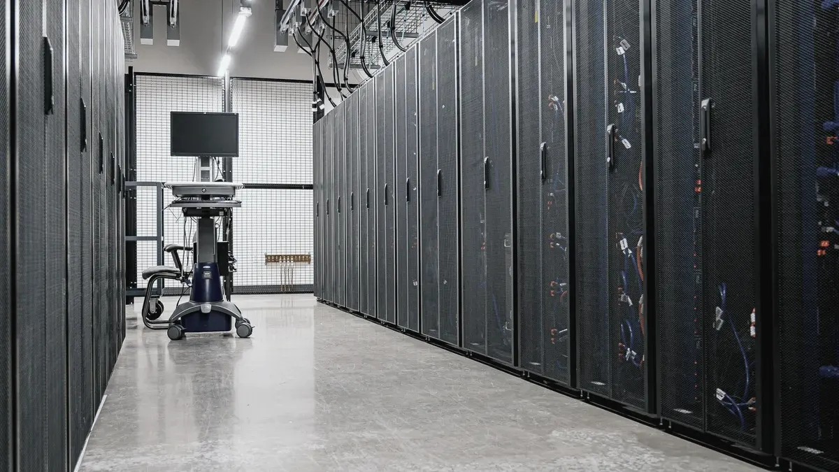 A quiet corridor between rows of server cabinets